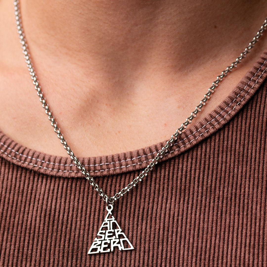 Collar triangulo CANSERBERO